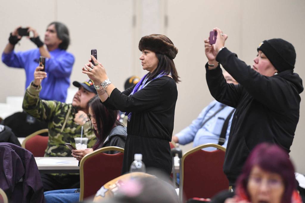 Juneau residents watch the Yaaw Tei Yi Dance Group perform during the Southeast Alaska Native Veterans Veterans Day luncheon at the Elizabeth Peratrovich Hall on Monday, Nov. 11, 2019. (Michael Penn | Juneau Empire)