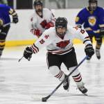 Juneau-Douglas Josh Frisby moves the puck against Monroe Catholic at the Treadwell Arena on Friday, Nov. 15, 2019. JDHS won 13-0. (Michael Penn | Juneau Empire)