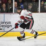 Juneau-Douglas Dylan Murdoch moves the puck against Monroe Catholics Sophie Fowler at the Treadwell Arena on Friday, Nov. 15, 2019. JDHS won 13-0. (Michael Penn | Juneau Empire)