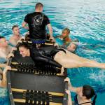Yeoman 1st Class Danica Vandenberg, a Coast Guardsman stationed in Juneau, takes a boating safety training class at the Augustus Brown Swimming Pool on Tuesday, Nov. 19, 2019. The class will qualify the members to teach students around the state about the use and importance of life vests. (Michael Penn | Juneau Empire)