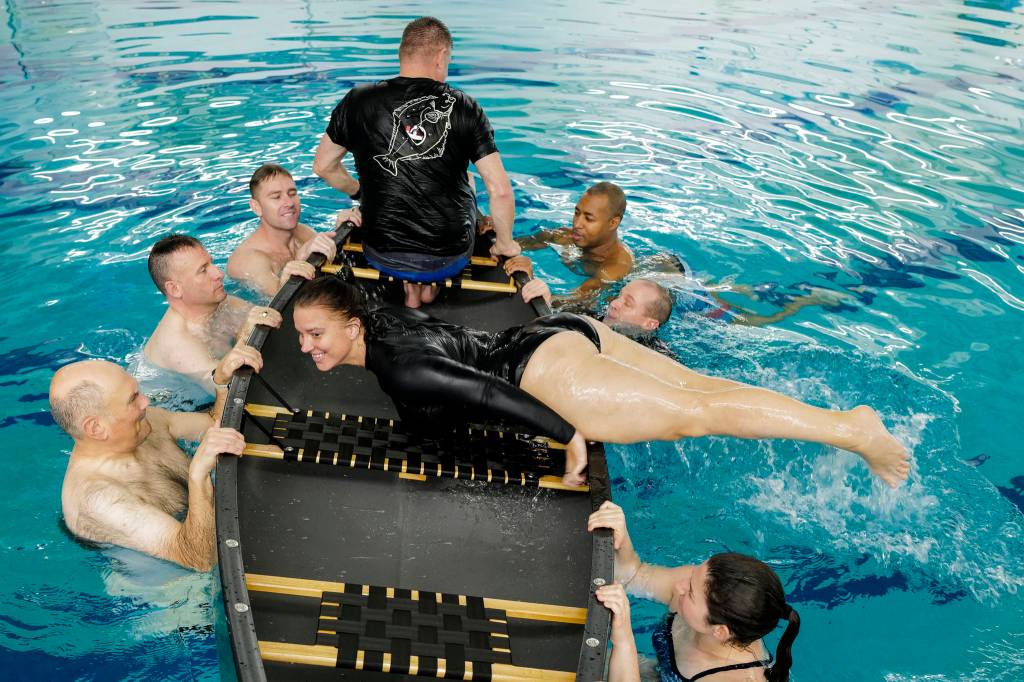 Yeoman 1st Class Danica Vandenberg, a Coast Guardsman stationed in Juneau, takes a boating safety training class at the Augustus Brown Swimming Pool on Tuesday, Nov. 19, 2019. The class will qualify the members to teach students around the state about the use and importance of life vests. (Michael Penn | Juneau Empire)