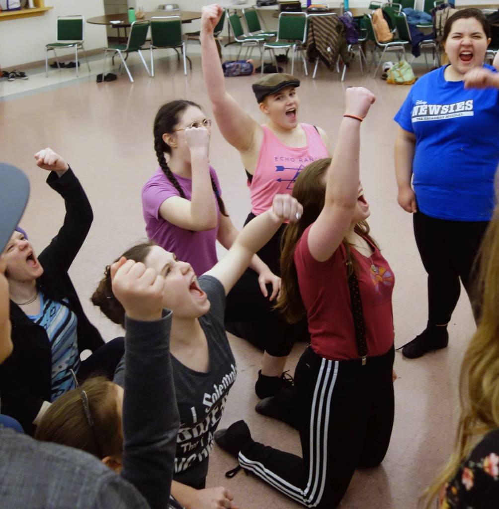 Newsboys raise their voices and fists during during rehearsals for Newsies, Friday, Nov. 15. Theatre at Latitude 58s latest production runs this weekend. (Ben Hohenstatt | Capital City Weekly)