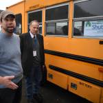 Cold Weather Emergency Shelter Manager Richard Cole, left, and St. Vincent de Paul Society Juneau General Manager Bradley Perkins show their used school bus on Wednesday, Nov. 20, 2019, that will be used to transport people needing a warm place to sleep to the shelter at St. Vincent de Paul. (Michael Penn | Juneau Empire)