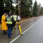 Juneau Police Department officers document a single-vehicle wreck near Mile 20 Glacier Highway that left 2 dead and 2 in critical condition on Thursday, Nov. 21, 2019. (Michael Penn | Juneau Empire)
