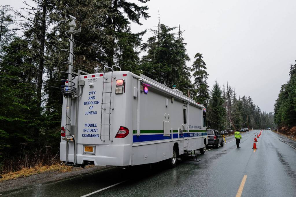 Juneau Police Department officers document a single-vehicle wreck near Mile 20 Glacier Highway that left 2 dead and 2 in critical condition on Thursday, Nov. 21, 2019. (Michael Penn | Juneau Empire)