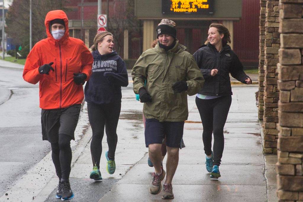 Coast Guardsmen and civilian employees dared the elements as they ran a 5K Turkey Trot down through Juneaus harborfront on Nov. 22, 2019. (Michael S. Lockett | Juneau Empire)