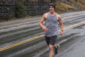 Lt. j.g. Jonathan Dillard hustles after the turnaround during a Coast Guard 5K Turkey Trot through Juneaus harborfront on Nov. 22, 2019. (Michael S. Lockett | Juneau Empire)