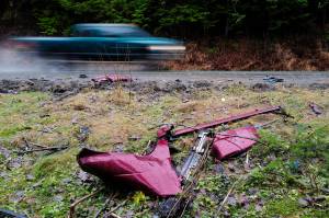 Pieces from a single vehicle accident near Mile 20 remain along Glacier Highway on Friday, Nov. 22. The Thursday morning accident left two dead and two in critical condition. (Michael Penn | Juneau Empire)