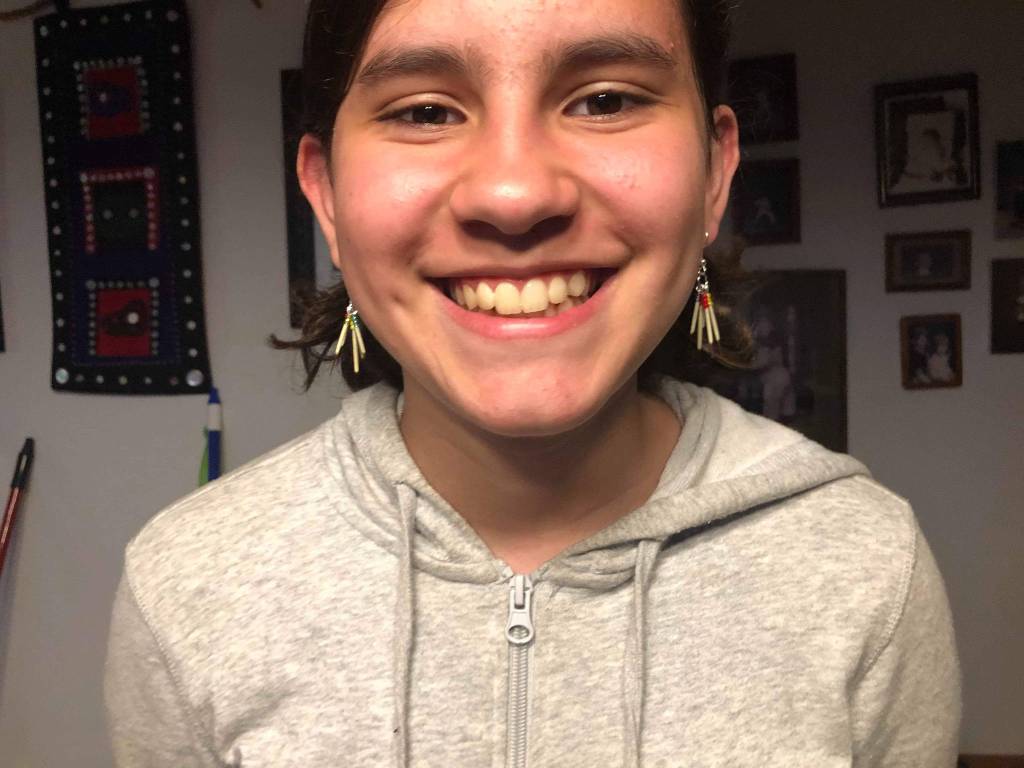 Rhiannon Wenzel models her sisters porcupine quill earrings in Wrangell. (Courtesy Photo | Maleah Wenzel)
