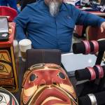Tsimshian artist Abel Ryan waits for customers at the Public Market in the Elizabeth Peratrovich Hall on Friday, Nov. 23, 2018. (Michael Penn | Juneau Empire File)
