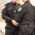 Tyler Reid shakes Chief Ed Mercers hand after being sworn into the Juneau Police Department as an officer on Wednesday, Nov. 27, 2019. (Michael S. Lockett | Juneau Empire)