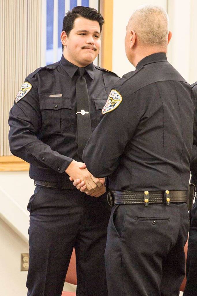 Tyler Reid shakes Chief Ed Mercers hand after being sworn into the Juneau Police Department as an officer on Wednesday, Nov. 27, 2019. (Michael S. Lockett | Juneau Empire)