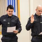 Tyler Reid, left, and Sean Imhof, right, are sworn into the Juneau Police Department as officers on Wednesday, Nov. 27, 2019. (Michael S. Lockett | Juneau Empire)