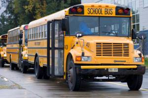 School buses drop students off at Thunder Mountain High School in September 2015. (Michael Penn | Juneau Empire File)