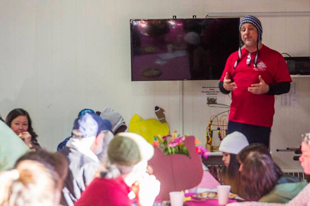 John Smith, a cultural specialist for Yaakoosge Daakahidi High School, spoke to students and parents during a Thanksgiving meal at the Zach Gordon Youth Center on Nov. 27, 2019 following a crash that killed two YDHS students last week. (Michael S. Lockett)