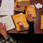 League of Women Voters of Juneau volunteers prepare Annie Boochevers book about civil rights leader Elizabeth Peratrovich, Fighter in Velvet Gloves, for mailing at the Andrew P. Kashevaroff Building on Monday, Dec. 2, 2019. Over 450 copies of the book were packaged to be shipped to libraries and school across Alaska. (Michael Penn | Juneau Empire)