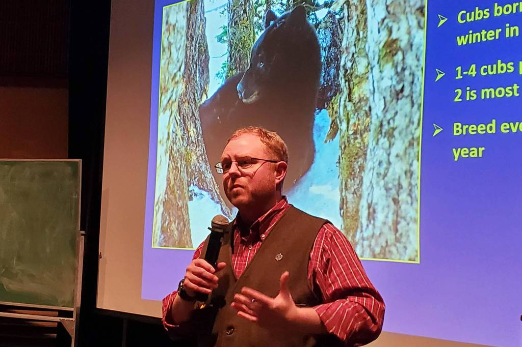 Alaska Department of Fish and Game wildlife biologist Ryan Scott talks about transitional bears during a Wildlife Wednesday talk at University of Alaska Southeasts Egan lecture hall. (Ben Hohenstatt | Juneau Empire)