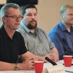 John McConnochie, of Cycle Alaska, left, speaks about the cruise industry in Juneau during a panel discussion with Drew Green, Port Manager at Cruise Line Agencies, center, and Mike Tibbles, of Cruise Lines International Association, at the Juneau Chamber of Commerces weekly luncheon at the Moose Lodge on Thursday, Dec. 5, 2019. (Michael Penn | Juneau Empire)