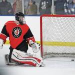 Juneau-Douglas goaltender Cody Mitchell turns to see the puck sliding into the net during a Friday, Dec. 6, 2019 hockey game against Homer High School at the Kevin Bell Arena in Homer, Alaska. (Photo by Megan Pacer/Homer News)