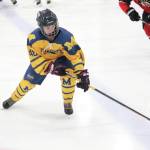 Homers Fiona Hatton reaches for the puck during a Friday, Dec. 6, 2019 hockey game against Juneau-Douglas High School at the Kevin Bell Arena in Homer, Alaska. (Photo by Megan Pacer/Homer News)