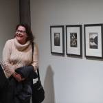 Iris Korhonen-Penn, right, talks with friends Mike Hekkers and Di Johnson about her work at the Alaska Positive juried photography exhibit at the Alaska State Museum during Gallery Walk on Friday, Dec. 6, 2019. Korhonen-Penn of Juneau received an Award of Recognition for her set of four pictures. (Michael Penn | Juneau Empire)
