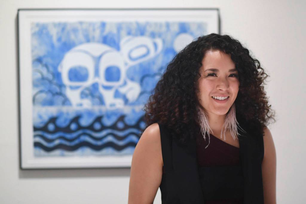Crystal Worl greets people during her opening at the Juneau-Douglas City Museum during Gallery Walk on Friday, Dec. 6, 2019. (Michael Penn | Juneau Empire)