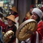 Nancy Barnes leads the Yees ku.oo Dancers in a song on Front Street during Gallery Walk on Friday, Dec. 6, 2019. (Michael Penn | Juneau Empire)