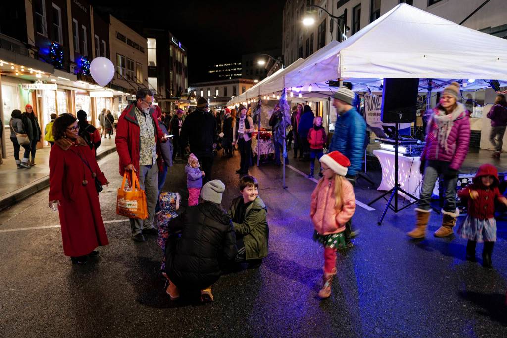 Residents walk Front Street during Gallery Walk on Friday, Dec. 6, 2019. (Michael Penn | Juneau Empire)
