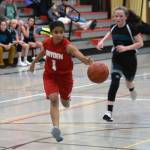 Floyd Drydens Jadid Polanco runs down the basketball while Dzantiki Heenis Cambry Lockhart gives chase during a round-robin game at the Icebreaker Tournament at FDMS on Friday, Dec. 6, 2019. (Nolin Ainsworth | Juneau Empire)
