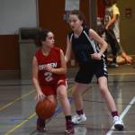 Floyd Drydens Jadid Polanco protects the ball as Dzantiki Heenis Jenna Dobson defends during a round-robin game at the Icebreaker Tournament at FDMS on Friday, Dec. 6, 2019. (Nolin Ainsworth | Juneau Empire)