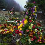 Two crosses ladened with flowers memorialize a 19-year-old woman and a 15-year-old boy who were killed in an vehicle accident near Mile 20 on Glacier Highway on Nov. 21. Two others were injured. (Michael Penn | Juneau Empire)