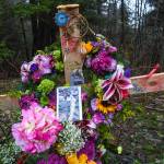 Two crosses ladened with flowers memorialize a 19-year-old woman and a 15-year-old boy who were killed in an vehicle accident near Mile 20 on Glacier Highway on Nov. 21. Two others were injured. (Michael Penn | Juneau Empire)