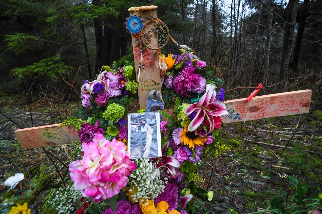 Two crosses ladened with flowers memorialize a 19-year-old woman and a 15-year-old boy who were killed in an vehicle accident near Mile 20 on Glacier Highway on Nov. 21. Two others were injured. (Michael Penn | Juneau Empire)