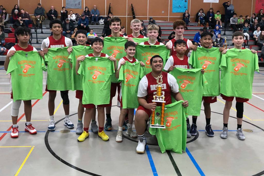 The Floyd Dryden Middle School boys A basketball team poses with the Icebreaker Tournament championship trophy at FDMS on Saturday, Dec. 7, 2019. Back row (L to R): Lance Nierra, Antone Araujo, Alwen Carrillo, Thomas Baxter, Jonathan Sleppy, Sean Oliver, Levi Traxler, Joren Gasga, Kasen Ludeman. Front row: TJ Guevarra, Brandon Casperson, Jace Ribao, Primo Nauer. (Courtesy photo | John Sleppy)