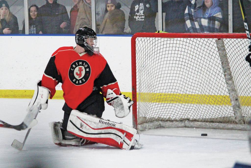 Juneau-Douglas: Yadaat.at Kalé goaltender Cody Mitchell turns to see the puck sliding into the net during a Friday, Dec. 6, 2019, hockey game against Homer High School at the Kevin Bell Arena in Homer. (Megan Pacer | Homer News)