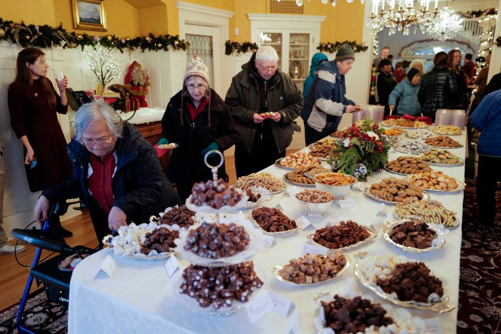 Juneau residents choose their cookies at the Governors Open House on Tuesday, Dec. 10, 2019. (Michael Penn | Juneau Empire)