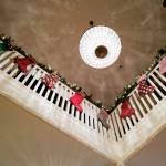 Stockings hang decorate the second floor balcony during the Governors Open House on Tuesday, Dec. 10, 2019. (Michael Penn | Juneau Empire)