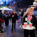 Amanda Price, Commissioner of the Department of Public Safety, serves hot cider outside during the Governors Open House on Tuesday, Dec. 10, 2019. (Michael Penn | Juneau Empire)