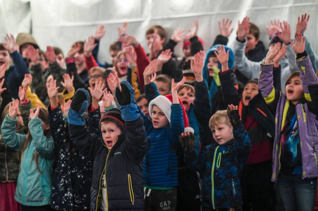 Students with the Faith Community Christian School sing outside during the Governors Open House on Tuesday, Dec. 10, 2019. (Michael Penn | Juneau Empire)