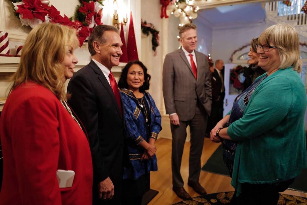 Juneau Mayor Beth Weldon, right, is greeted by Gov. Mike Dunleavy, R-Alaska, and his wife, Rose, Lt. Gov. Kevin Meyer and his wife, Marti, at the Governors Open House on Tuesday, Dec. 10, 2019. (Michael Penn | Juneau Empire)