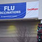Fred Meyer advertises flu vaccinations via a banner outside its pharmacy on Wednesday, Dec. 11, 2019. (Michael Penn | Juneau Empire)