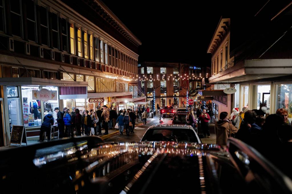 Residents walk Seward Street during Gallery Walk on Friday, Dec. 6, 2019. (Michael Penn | Juneau Empire)