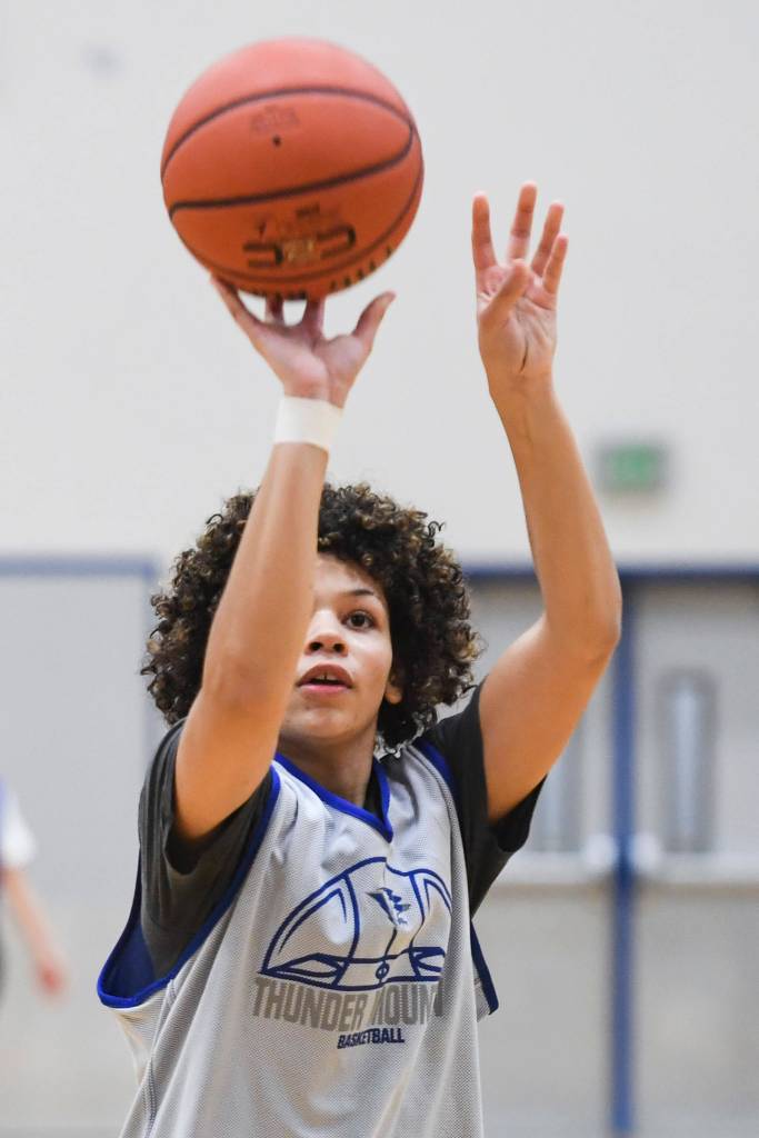 Tzadi Hauck shoots during the girls varsity basketball practice at Thunder Mountain High School on Monday, Dec. 9, 2019. (Michael Penn | Juneau Empire)