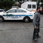 Bill Peters waits near a police cruiser at the Department of Transportation and Public Facilities Buildig on Channel Drive on Wednesday, Dec. 11, 2019. Police found Peters stolen vehicle parked in the departments lot. (Michael Penn | Juneau Empire)