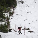 Ski Patroller Ted Hanrahan takes down bamboo hazard markers on Lower Hilarys at Eaglecrest Ski Area on Thursday, Dec. 12, 2019. (Michael Penn | Juneau Empire)