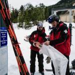 Ski Patrollers Tucker Cooper, left, and Calder Otsea bag bamboo hazard markers at Eaglecrest Ski Area on Thursday, Dec. 12, 2019. (Michael Penn | Juneau Empire)