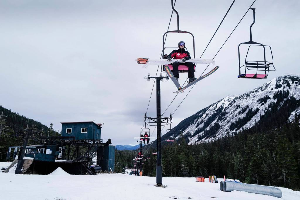 Ski Patrollers ride the Hooter Chairlift as they work at Eaglecrest Ski Area on Thursday, Dec. 12, 2019. (Michael Penn | Juneau Empire)