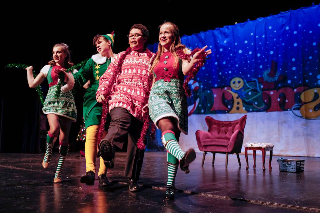 Kayla Kohlhase, left, Toby Russell, Roman Mahanyu, Shelby Yor, right, rehearse Elf the Musicial at Juneau-Douglas High School: Yadaa.at Kalé on Friday, Dec. 13, 2019. (Michael Penn | Juneau Empire)