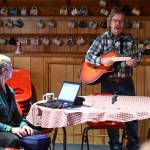 SEACCs former Executive Director Bart Koehler sings his testimony to oppose the U.S. Forest Services lifting of the Roadless Rule as stenographer Lynda Barker records are Northern Light United Church on Dec. 16, 2019. (Michael Penn | Juneau Empire)