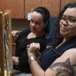 Anastasia Hobson-George, right, works with weaver Lily Hope as the Artist-in-Residence at the Walter Soboleff Center in May 2019. Hobson-George is one of the youngest-ever winners of a Rasmuson Foundation Individual Artist Award. Applications for the awards are now open. (Michael Penn | Juneau Empire File)